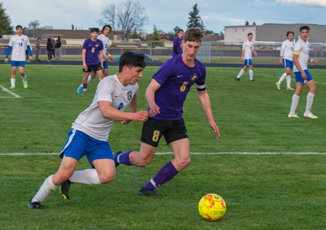 Sequim Gazette photo by Emily Matthiessen
Sequim’s Brandon Wagner, right, defends Gavin Tate of Bremerton in the Wolves’ 3-1 home loss to the Knights on April 26.