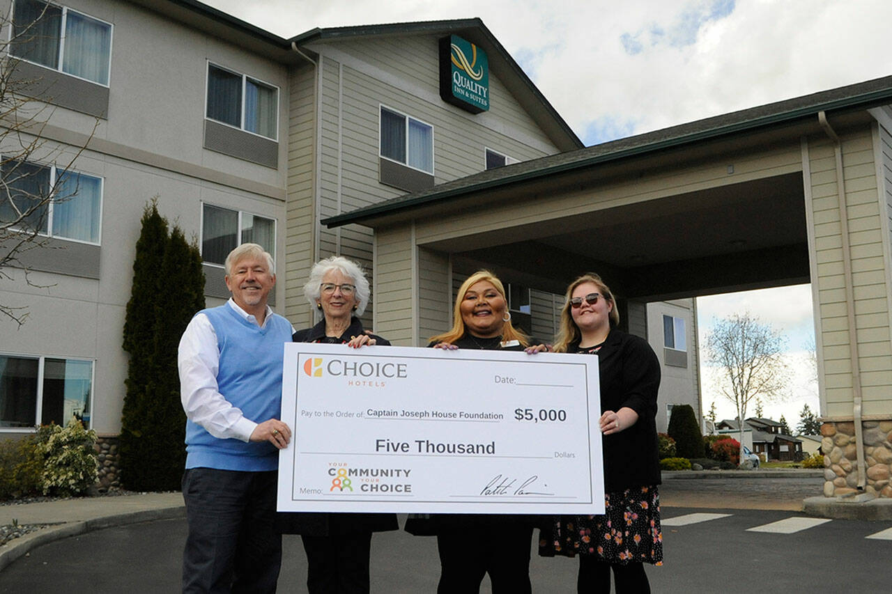 Matthew Nash/Sequim Gazette
Bret Wirta, owner of the Quality Inn and Suites in Sequim, on left, with General Manager Yolanda Pompa and Kaittlyn Reese, assistant general manager, present Betsy Reed Schultz, executive director of the Captain Joseph House Foundation, second from left, $5,000 to help bring families to the Port Angeles home for respite and support. Pompa applied for the grant through the hotel’s parent franchise Choice Hotels.