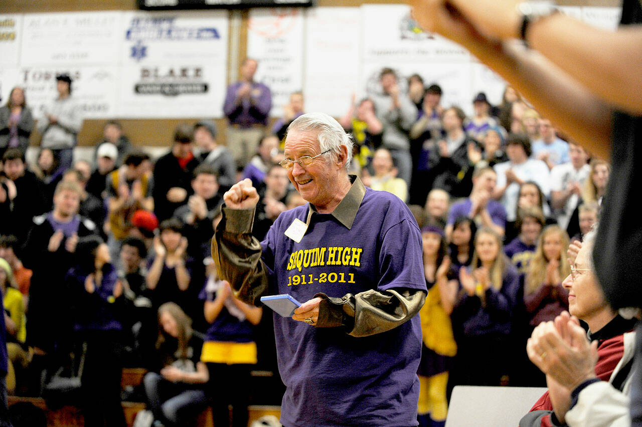 Sequim Gazette file photo by Michael Dashiell
Myron Teterud, a longtime Sequim schools and community supporter, gives the crowd a salute after being honored as “Fan of the Century” at Sequim High School’s centennial celebration in January 2011. Sequim School Board directors agreed to name the SHS athletic field in honor of Teterud, along with naming the stadium stáʔčəŋ, a S’Klallam word meaning “wolf.”