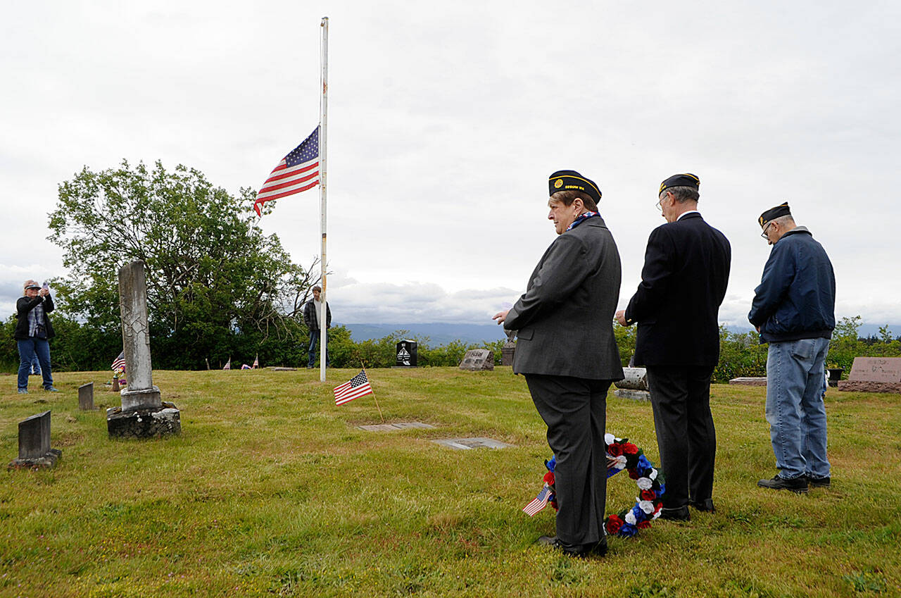Sequim Gazette photo by Matthew Nash/ American Legion Post 62 members, from left, chaplain Nancy Zimmermann, commander Paul Renick and acting sergeant in arms Phil Capogna prepare to being a Memorial Day service in Dungeness Cemetery for about 30 people.