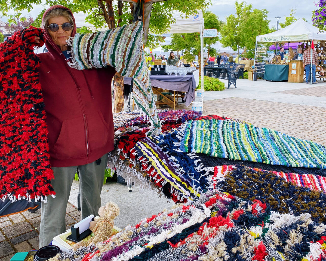 Emma Jane Garcia/Sequim Farmers & Artisans Market
Diane Frandsen of Raggedy Rug Company displays some of her colorful pieces at the Sequim Farmers & Artisans Market.