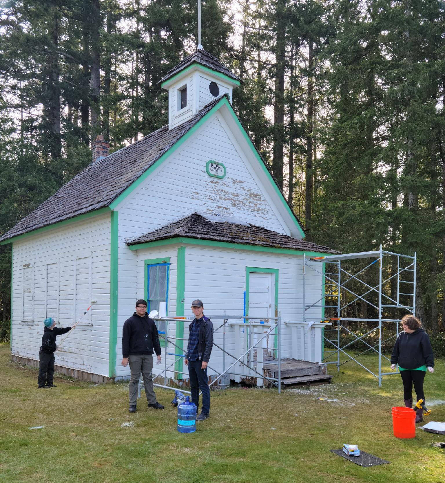 Andy Benitez, second from left, and fellow Scouts BSA members repaint of the Blue Mountain School earlier this year, Benitez’s culminating Eagle Scout project. Submitted photo