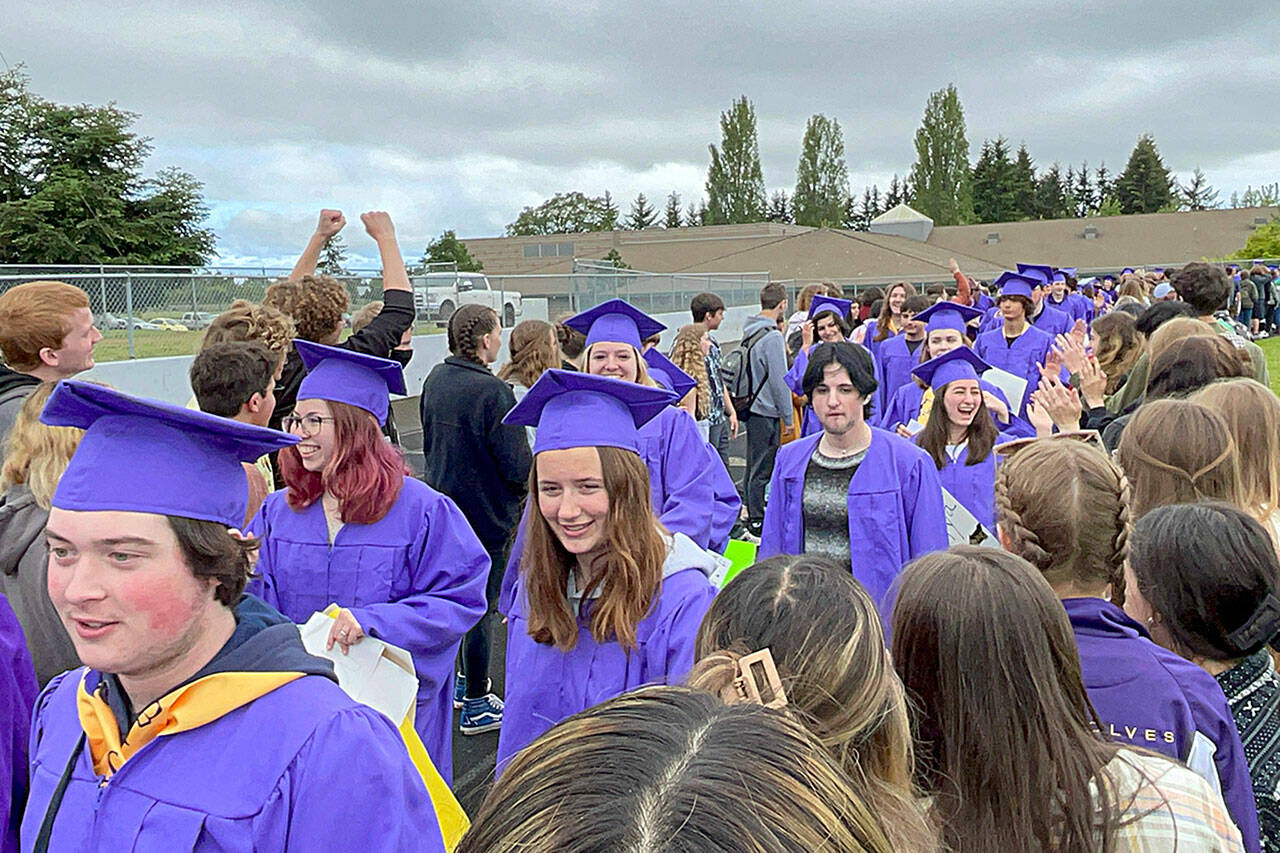 Sequim Gazette photo by Matthew Nash/ About 175 Sequim High seniors walk one lap on the morning of June 10 to be congratulated by students and staff from Sequim’s other schools.