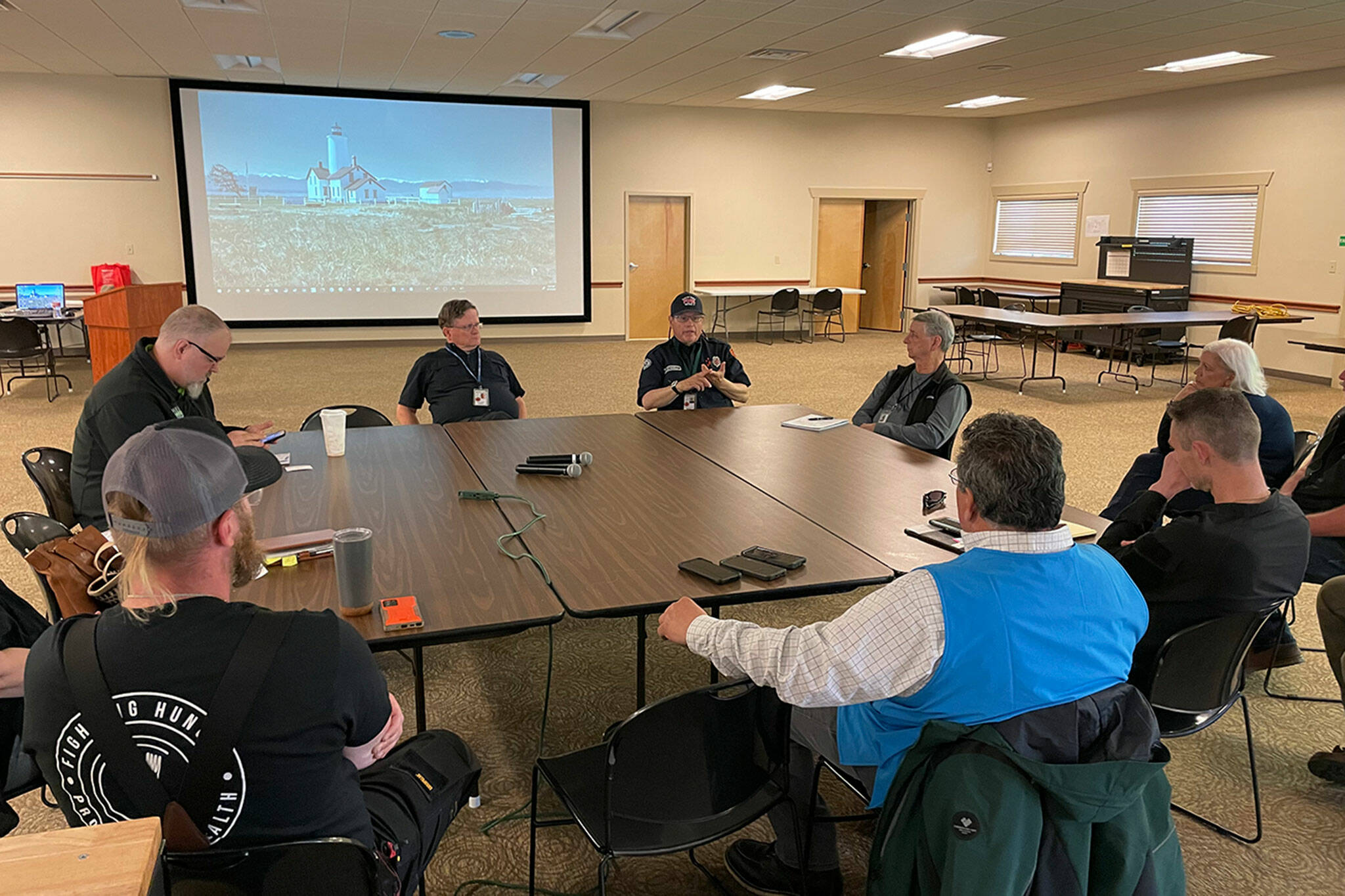 Sequim Gazette photo by Matthew Nash/ First responders and business retail leaders meet on June 16 to discuss logistics for food and supply distribution during a natural disaster.