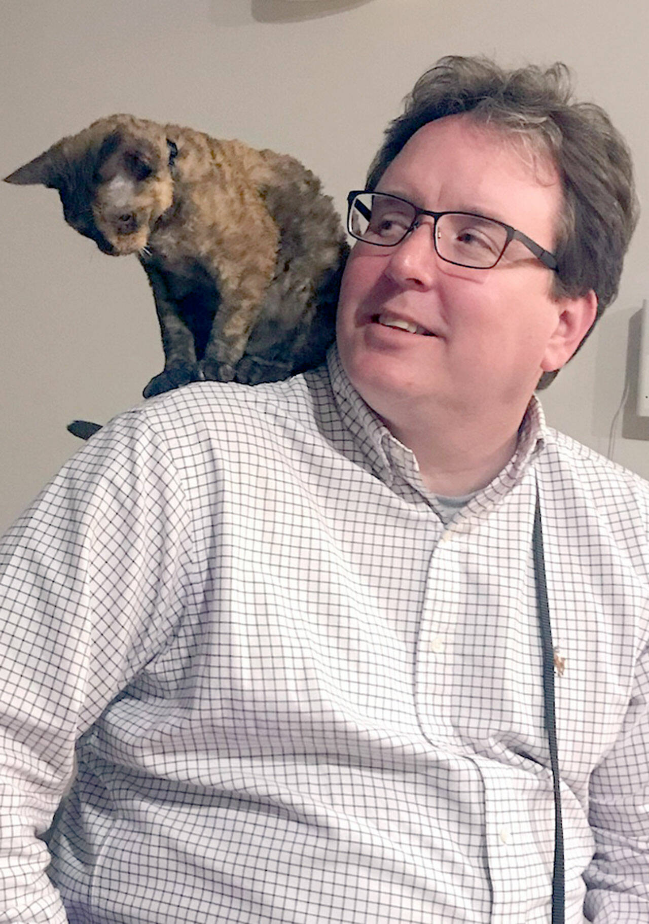 Ryan Malane, pictured with one of his cats, vice president and co-owner of Black Ball Ferry Line, died on June 13. Submitted photo