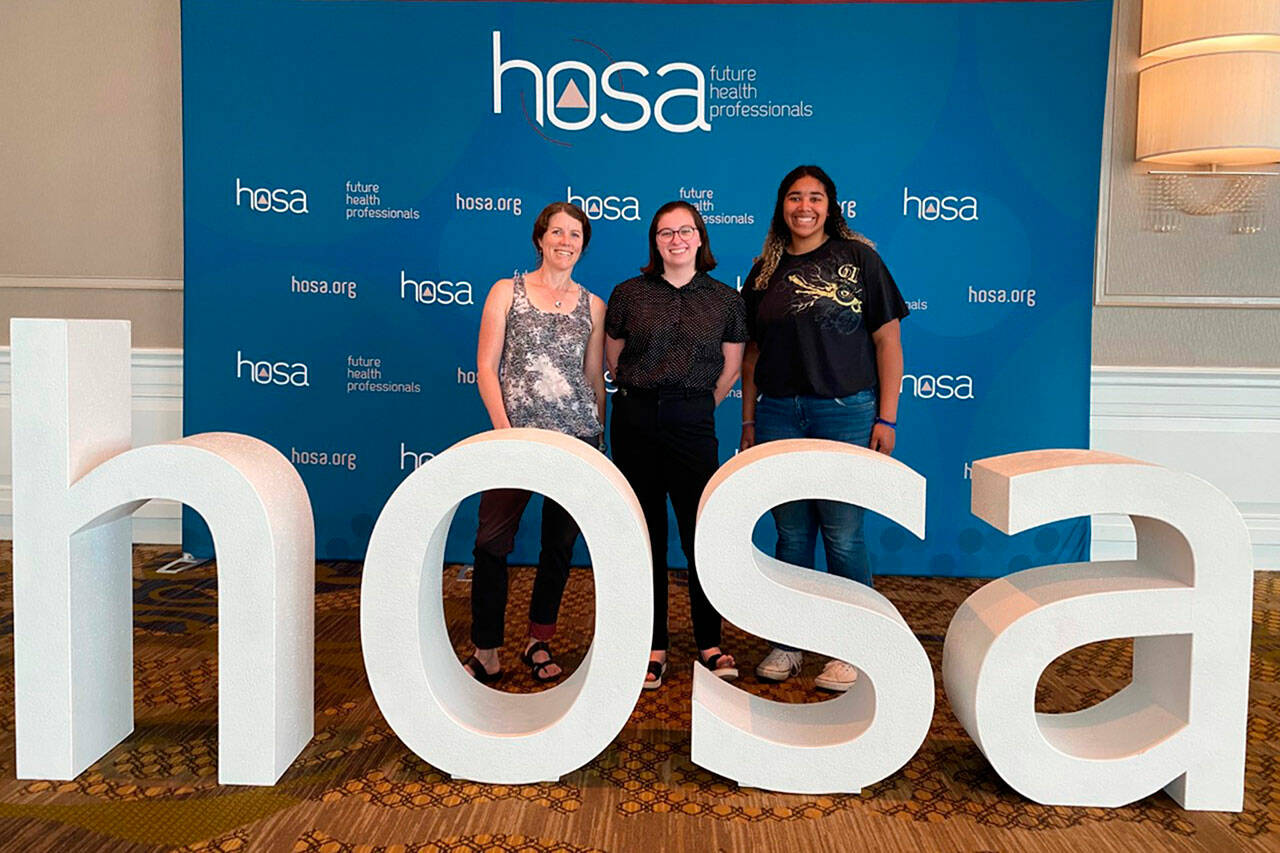 PhotoS courtesy Laura Gould
For the first time, Sequim High sent students to the HOSA international Leadership Conference, an event focused on promoting careers for future health professionals. Adviser Laura Gould, left, stands with Madelyn Pickens, center, and Jelissa Julmist, who competed in Family Medicine Physician and Sports Medicine.