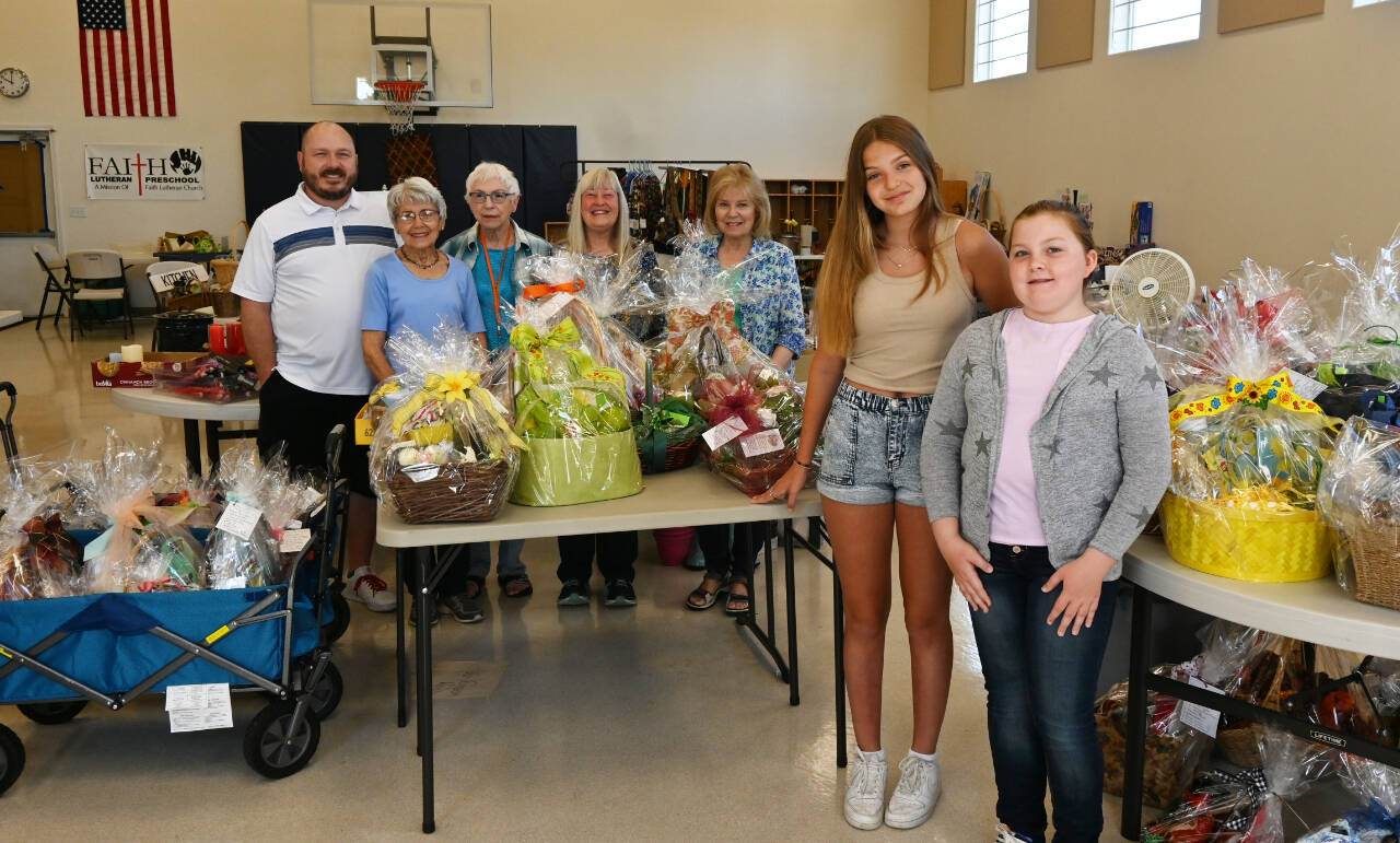 Sequim Gazette photo by Michael Dashiell
Organizers of the Faith Lutheran Preschool gift basket and tag sale set for Aug. 6 include, from left, pastor Roger Stites, Jackie Dawley, Jane Thompson, Wendy Merrill , Karen Adams, Kalleigh Thompson and Abigail Stites.