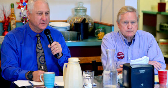 Brian Pruitt, a Republican candidate for state House of Representatives District 24, Position 2, left, speaks during a candidate debate at Joshua’s Restaurant in Port Angeles on Tuesday. Pruitt is challenging incumbent Steve Tharinger, a Democrat who’s held the seat since 2010, seated at right. (Peter Segall/Peninsula Daily News)