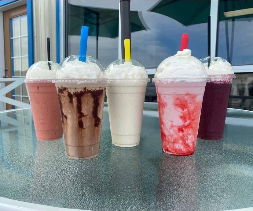 Photo courtesy of Belle’s Black Pot / Some of the many drinks available at Belle’s Black Pot at 131 River Road in Sequim, owned and operated by the Owen family: Good Morning smoothie (strawberry, peach, mango, pineapple, orange juice and oat milk), a chocolate milkshake, vanilla bean milkshake, strawberry milkshake, and Very Very Northwest berry smoothie (raspberry, blueberry, blackberry, lemonade and oat milk).