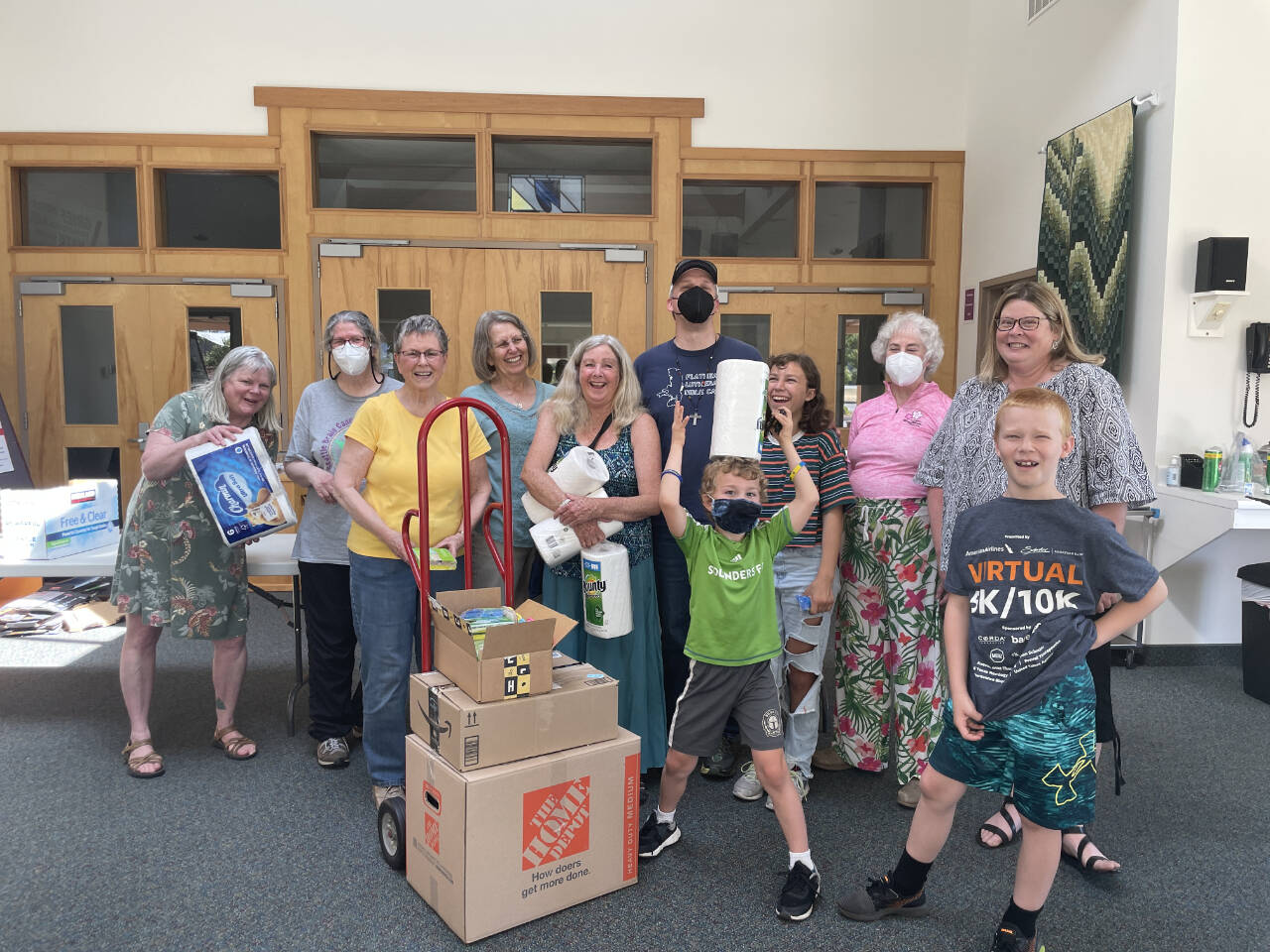 Photo courtesy of Dungeness Valley Lutheran Church/ Volunteers compile kits with housewares at Dungeness Valley Lutheran Church on July 26 for Ukrainian refugees now in Washington.