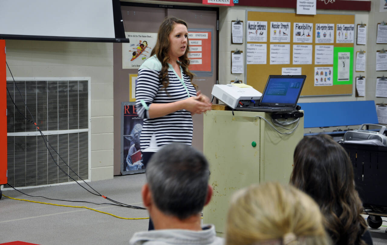 Submitted photo / Jennifer Lopez, then a teacher at Greywolf Elementary School, talks with parents about how to help their students become better readers at the Parent Night in October 2016. Lopez will take the role of principal at Greywolf this fall, superintendent Regan Nickels said.