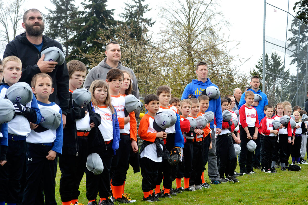 Sequim Gazette file photo by Matthew Nash
Players and coaches celebrate the opening of the Sequim Little League season in 2019.