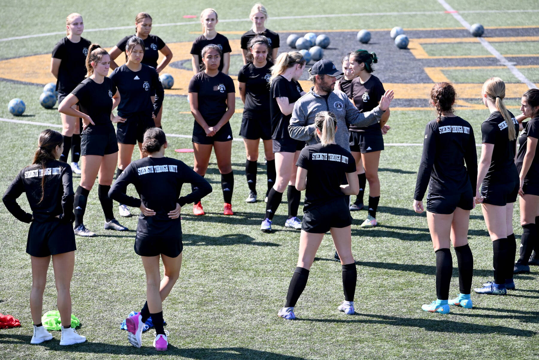 Photo courtesy of Peninsula College
Coach Kanyon Anderson works with members for the Peninsula College women’s soccer team at a practice earlier this month. The Pirates are defending NWAC champions.