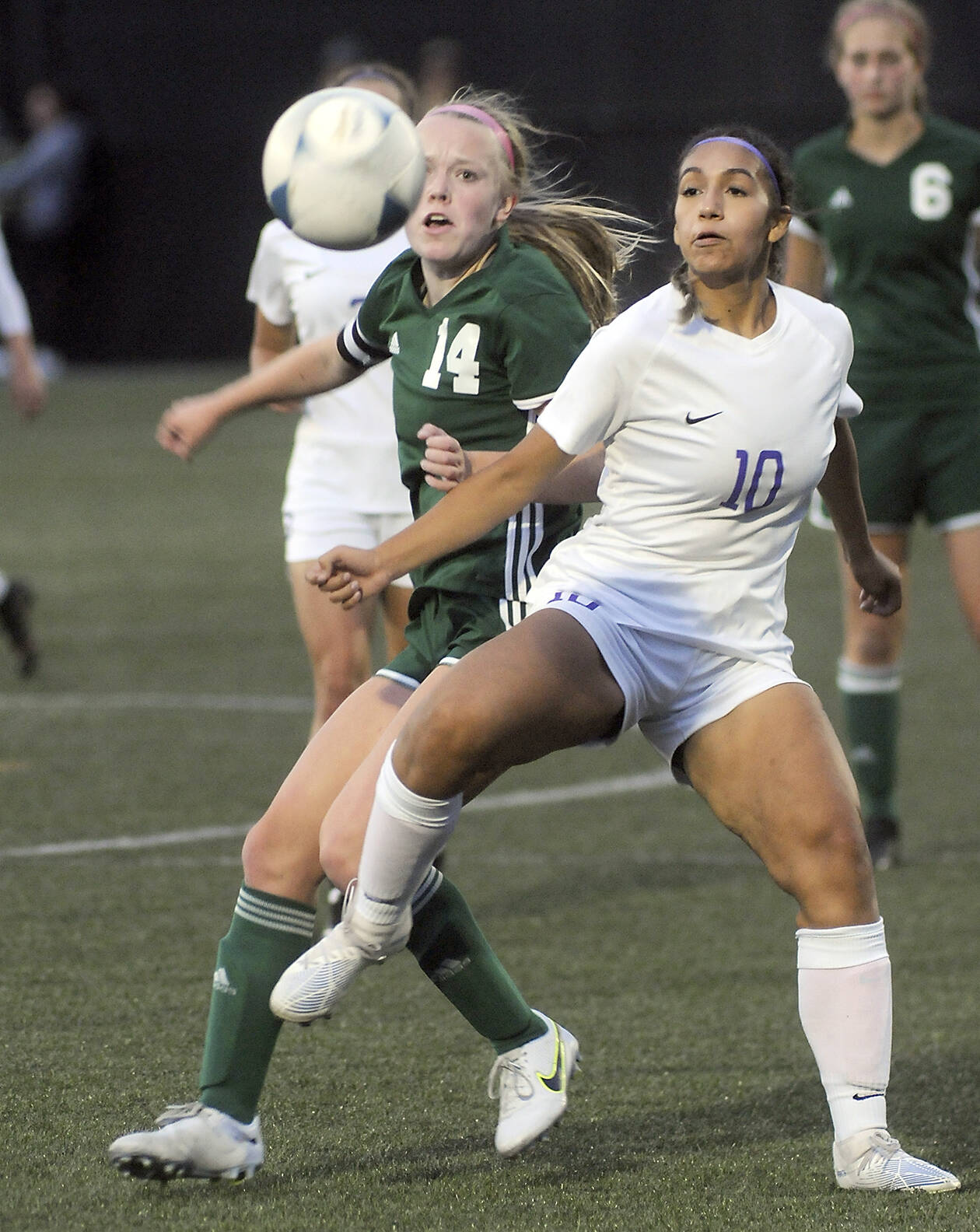 Photo by Keith Thorpe/Olympic Peninsula News Group / Port Angeles’ Anna Petty, left, fights for a loose ball with Sequim’s Jennyfer Gomez on Sept. 15 in Port Angeles.