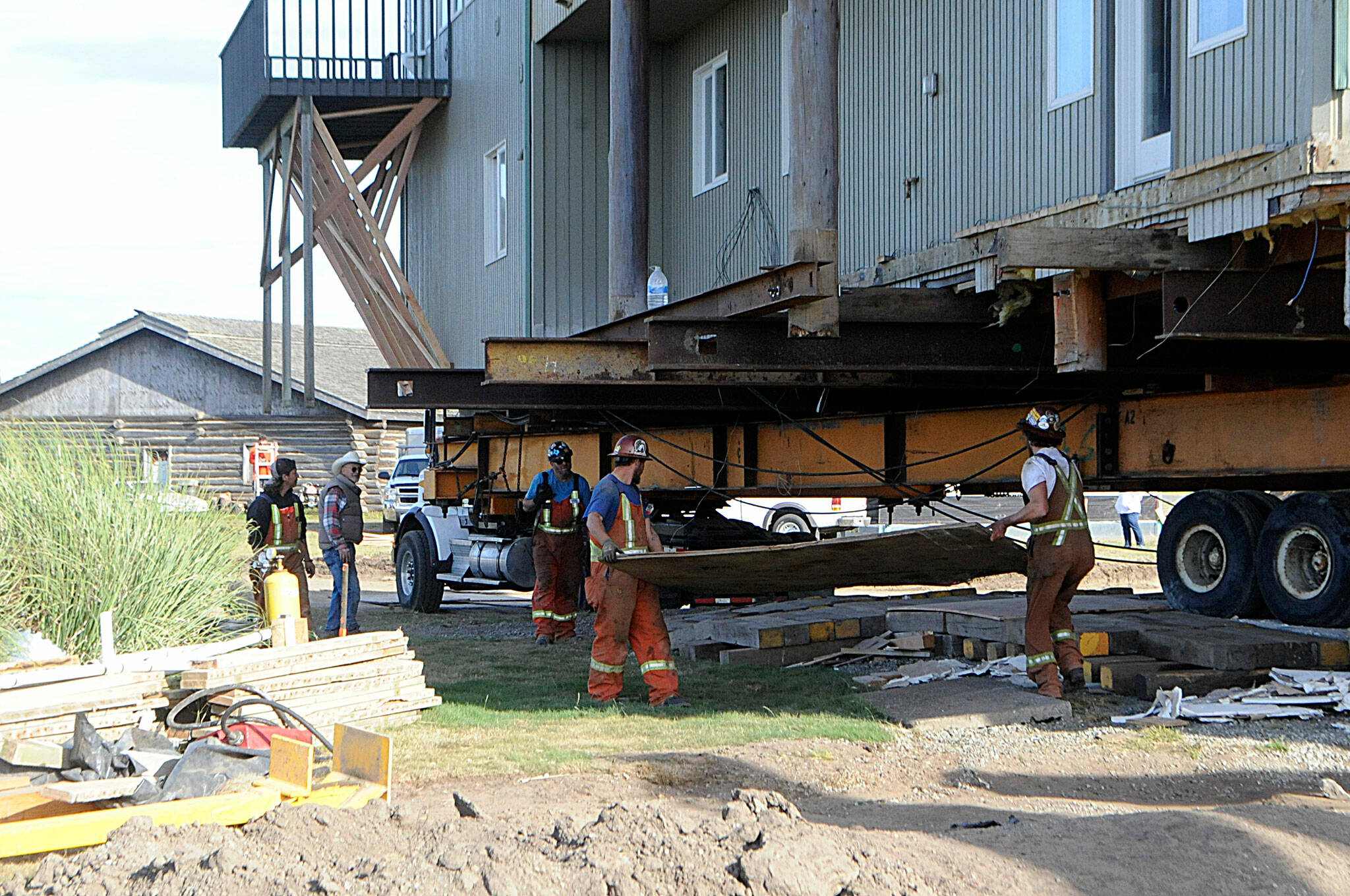 Sequim Gazette photo by Matthew Nash/ Large wooden planks helped Nickel Bros’s crew to better move a Dungeness home on Sept. 16.