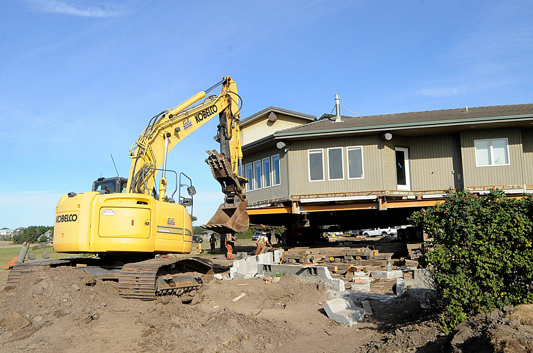 Sequim Gazette photo by Matthew Nash/ This Dungeness home was placed about 120 feet from the hillside on Sept. 16. Crews will work on utilities and foundation work in the coming month.