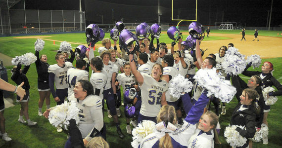 KEITH THORPE/PENINSULA DAILY NEWS
Members of the Sequim Wolves football team and cheer squad celebrate Friday night's 36-32 come-from-behind victory over the Port Angeles Roughriders at Port Angeles Civic Field.