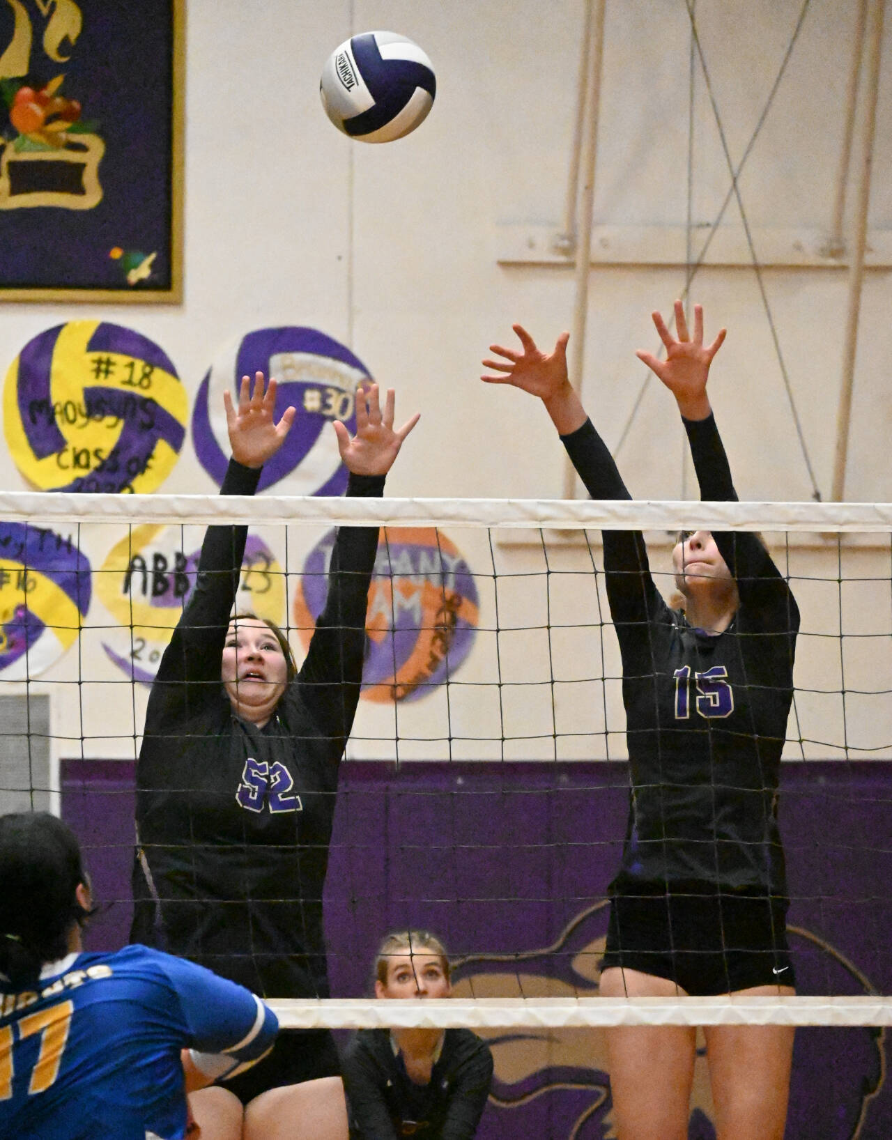 Sequim Gazette photo by Michael Dashiell / Sequim’s Sammie Bacon, left, and Kendall Hastings look to block a shot by Bremerton’s Cora Taylor in the Wolves’ three-set home win on Sept. 29.