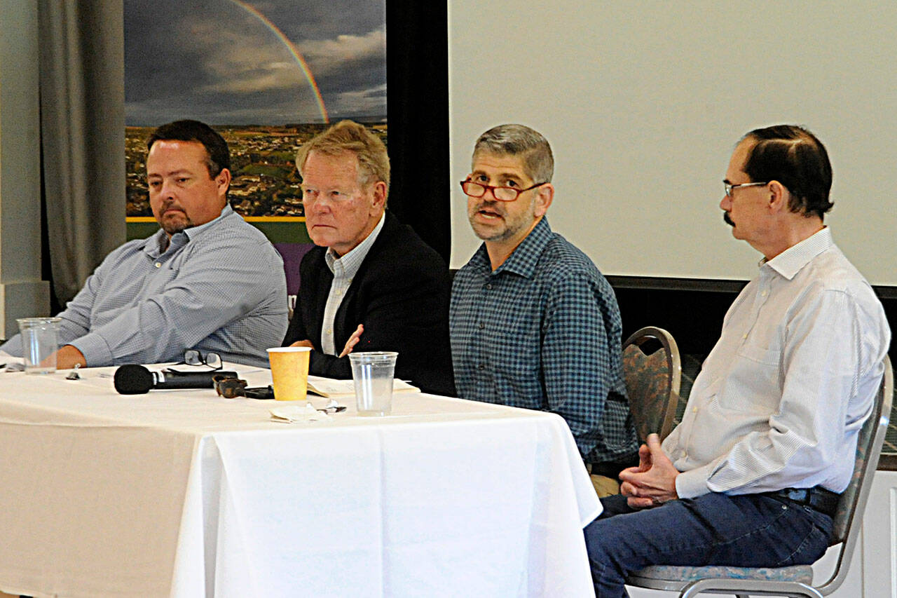 Sequim Gazette photo by Matthew Nash/ Clallam County commissioners, second from left, Randy Johnson, Mark Ozias, and Bill Peach, along with Mark Lane, Clallam County chief financial officer, on left, speak during the Sequim-Dungeness Valley Chamber of Commerce luncheon on Sept. 27. They touched on the varying 2023 budget, capital projects and general needs of residents.