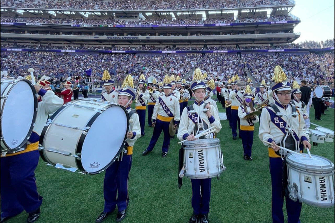 Submitted photo/ Sequim High and Middle School students play during the halftime show of the University of Washington’s football game on Sept. 10 as part of Husky Band Day.