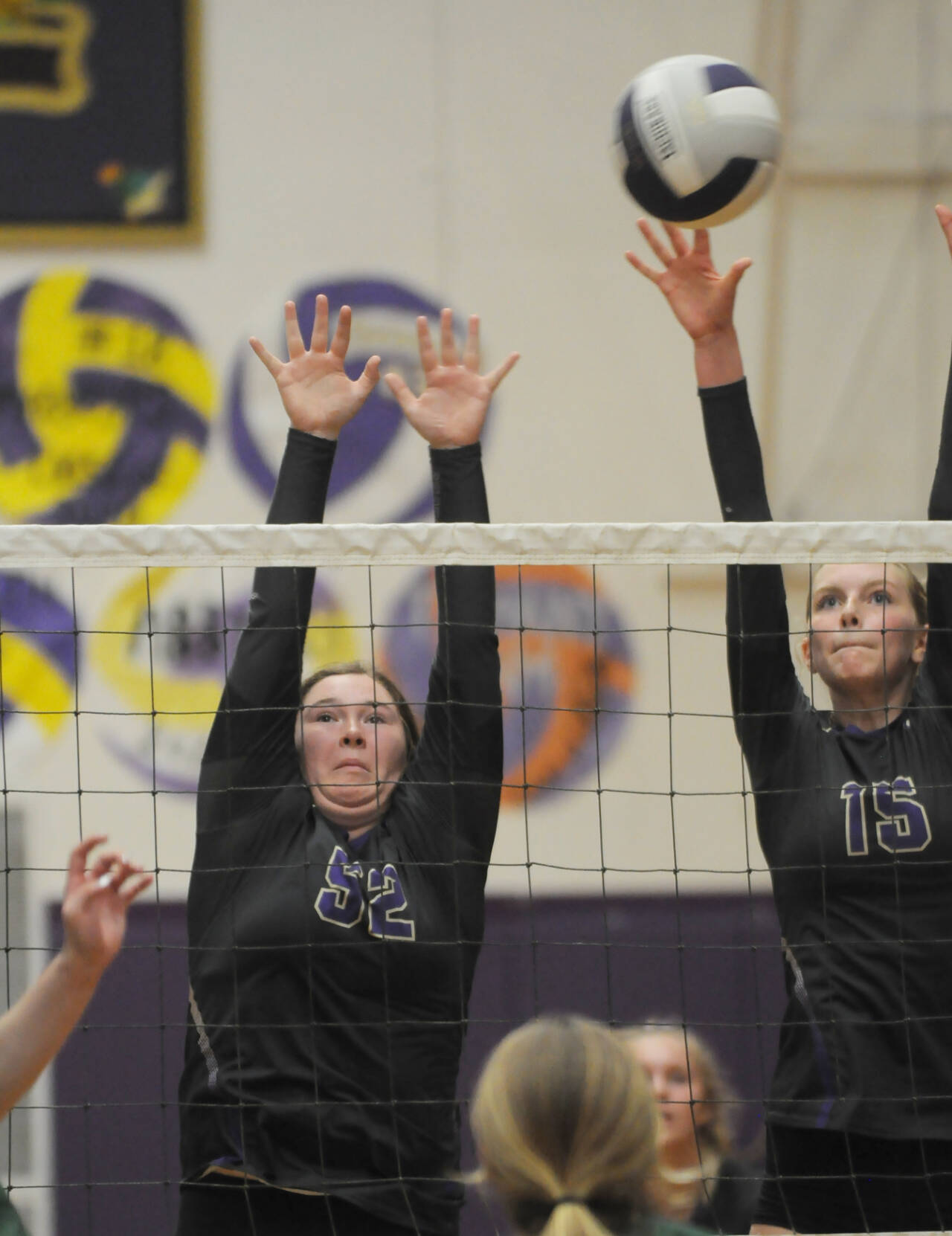 Sequim Gazette photo by Michael Dashiell
Sequim’s Sammie Bacon, left, and Kendall Hastings try to block a Port Angeles volley in the Wolves’ 3-1 win over their rivals on Oct. 11.