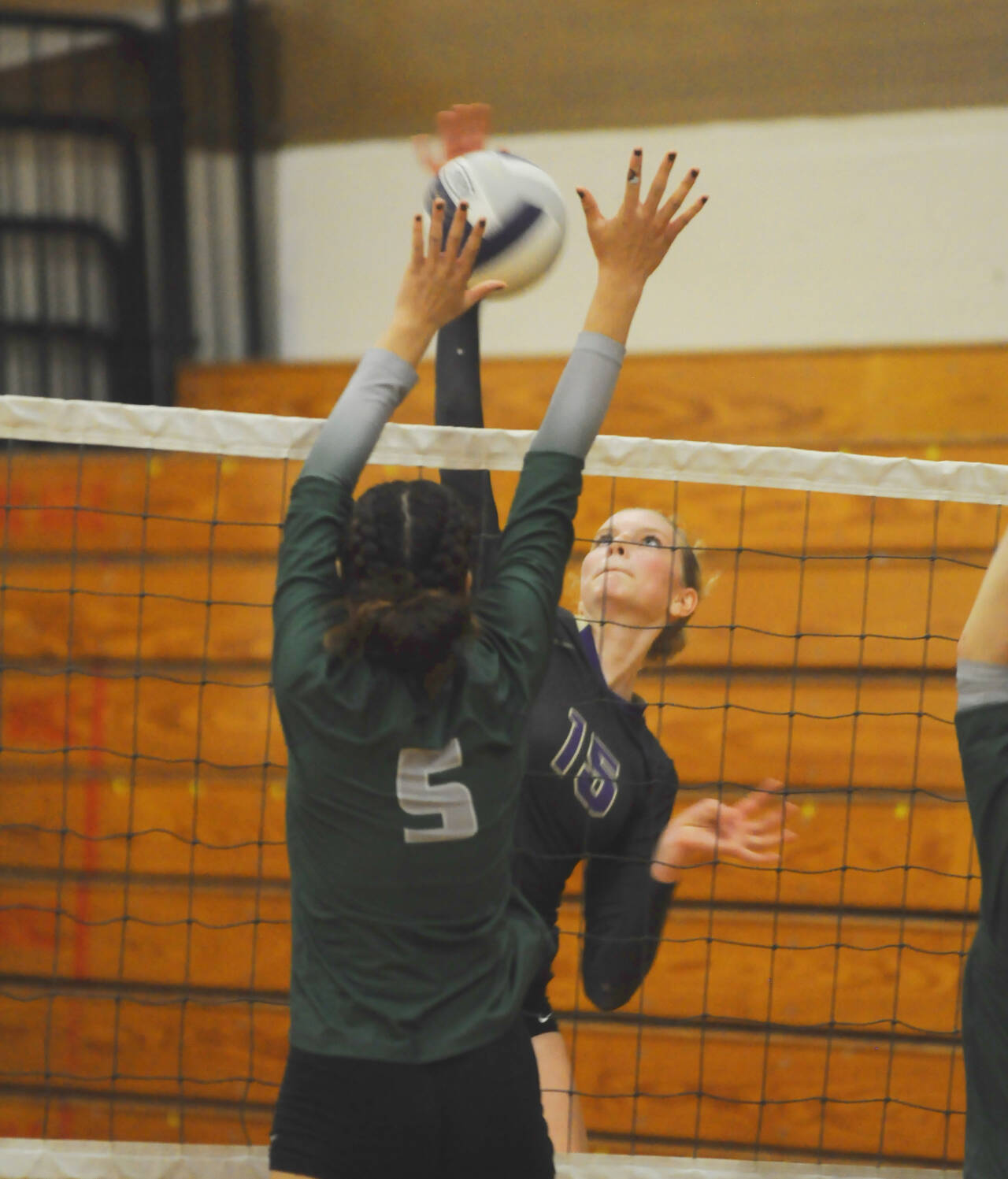 Sequim Gazette photo by Michael Dashiell / Sequim’s Kendall Hastings looks to hit past Port Angeles’ Karma Williams in the second game of a four-set Sequim home win on Oct. 11.