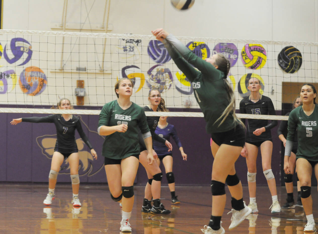Sequim Gazette photo by Michael Dashiell / Sequim players Sydney Clark (7), Anna Cowan (8) and Kendall Hastings (15) look on as Port Angeles players try to return a volley in the Wolves’ four-set home win on Oct. 11.