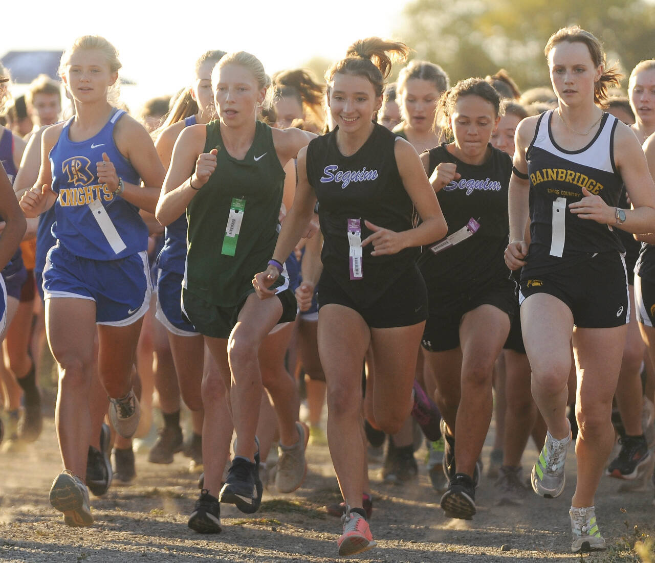 Sequim Gazette PHOTOS BY Michael Dashiell
Sequim’s Kaitlin Bloomenrader, center, leads the Wolves from the starting line at an Olympic League meet on Oct. 12 at Voice of America Park in Sequim. Bloomenrader was fourth in the meet (21:04).