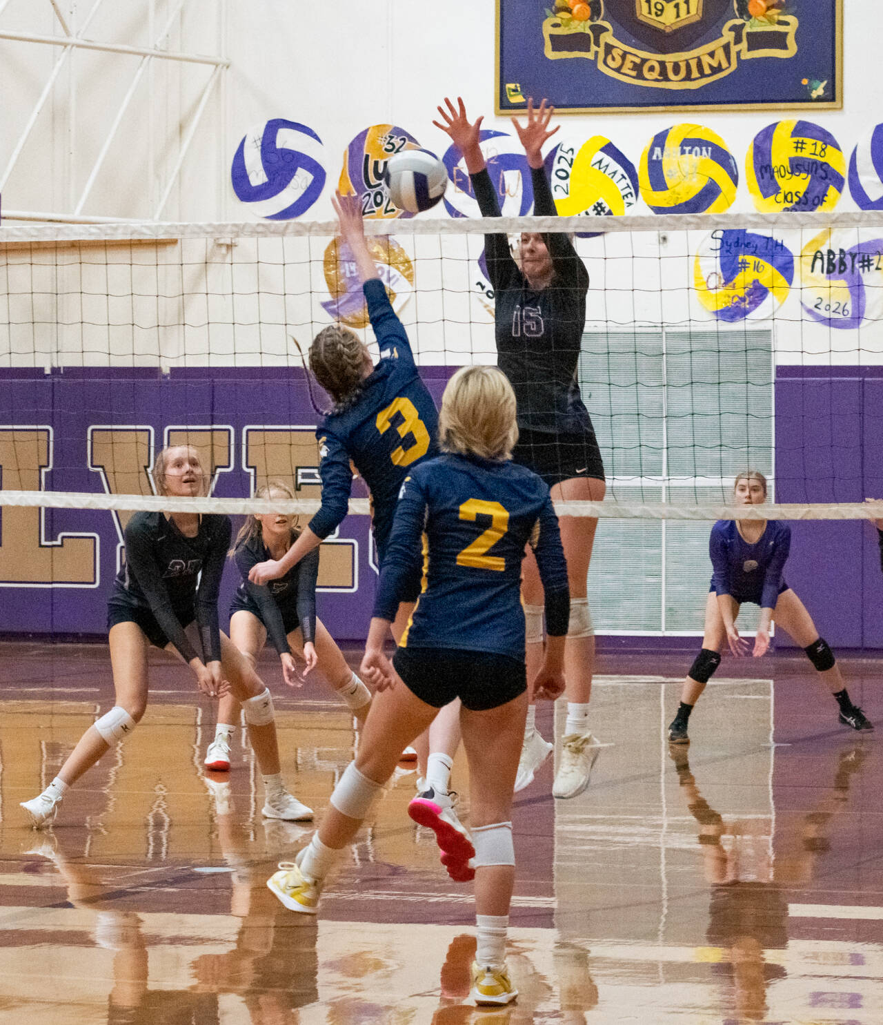 Sequim Gazette photo by Emily Matthiessen / Sequim’s Kendall Hastings (15) goes up to block a volley by Bainbridge’s Jameson Payne in Sequim’s three-set sweep of the 3A Spartans on Oct. 20.