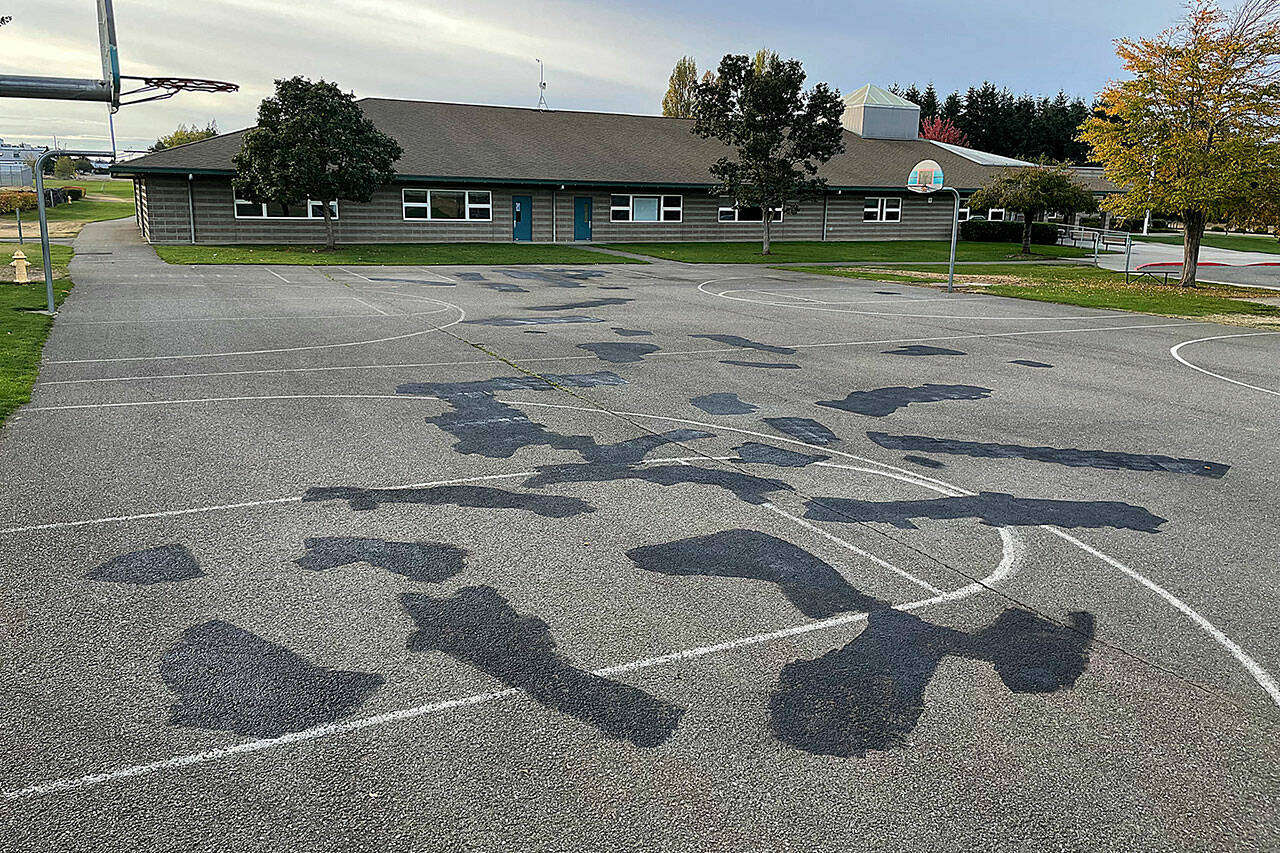 Sequim Gazette photo by Matthew Nash
More than 20 explicit graffiti taggings were found the morning of Oct. 23 at Sequim Middle School on the basketball court, parking signs and a classroom door. Sequim School district maintenance staff finished spray painting over the numerous graphic and sexual terms and images by Sunday afternoon. Sequim Police Sergeant Jeff Thaxton said they suspect at least one juvenile was involved and they continue to investigate and seek available video footage.