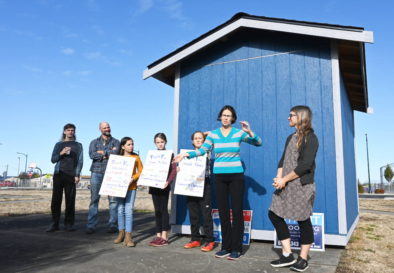 Michael Dashiell/Sequim Gazette
Jess Haugen, second from right, vice president of Olympic Peninsula Academy’s Parent-Teacher Organization, lauds the sponsors and volunteers who helped construct a playground equipment shed for the school. Pictured, from left, are Donovan Rynearson, OPA parent/board member Paul Rynearson, Mia Buhrer, Matilda Woodbury, Milo Haugen and OPA PTO president Lisa Bridge.