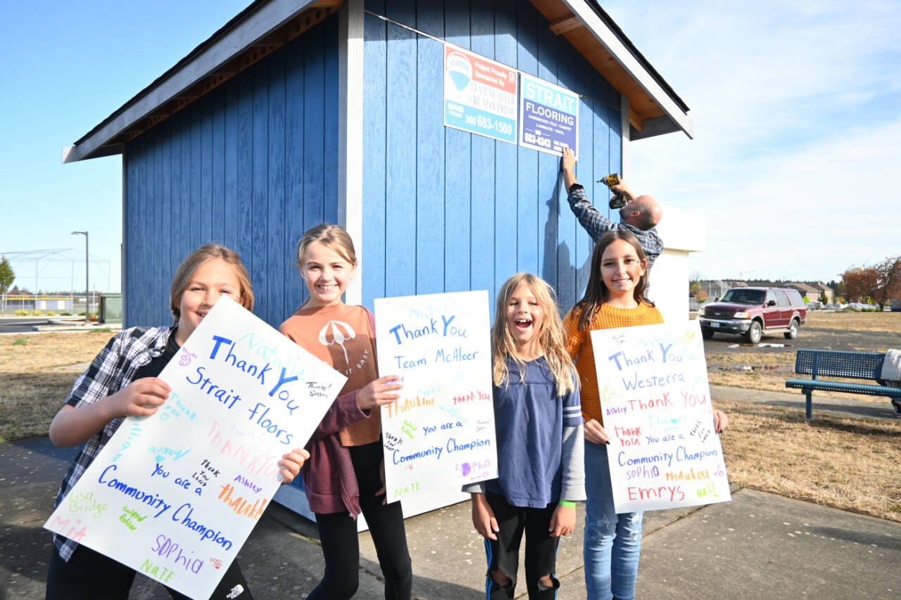 Sequim Gazette photo by Michael Dashiell / Youngsters (from left) Milo Haugen, Matilda Woodbury, Hawksley Haugen and Mia Buhrer on Oct. 28 thank sponsors for their contributions to fund a new playgroup equipment shed for Olympic Peninsula Academy classes.