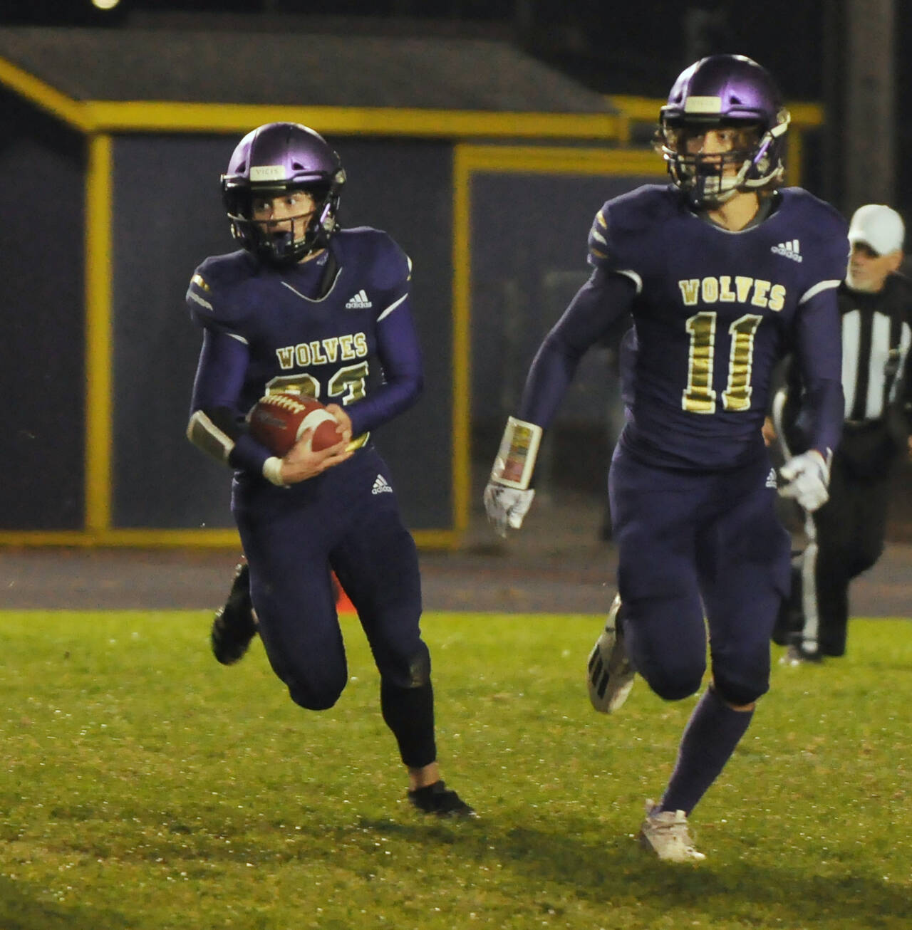 Sequim Gazette photo by Michael Dashiell / Sequim’s Sam Fitzgerald, left, looks for running room as Aiden Gockerell looks to provide a block in the Wolves’ season-finale against Bremerton on oct. 28. Fitzgerald had three first half touchdowns.