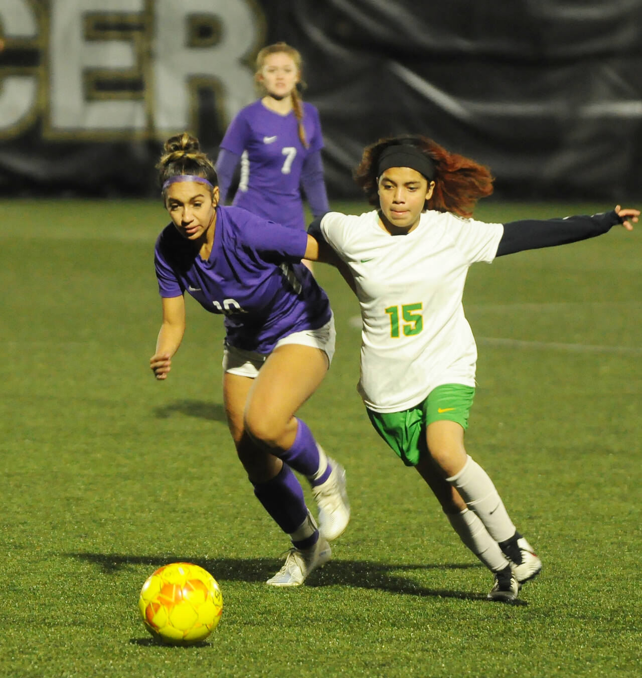 Sequim Gazette photo by Michael Dashiell / Sequim’s Jennyfer Gomez, left, battles with a Clover Park midfielder in the Wolves’ 2-0 win in the West Central District tourney opener on Nov. 1 in Port Angeles.
