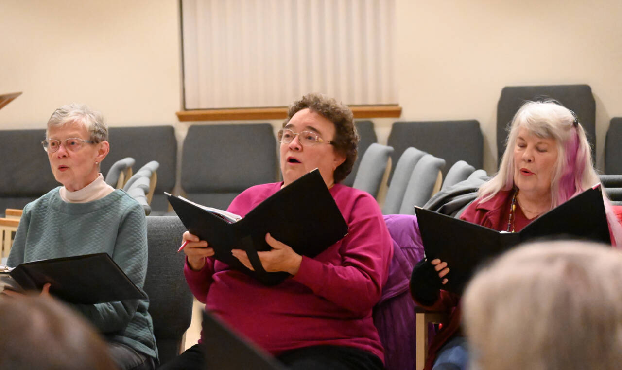 Peninsula Singers (from left) Betsy Brown, Jean Kipper and Rita Carrow rehearse for the group’s fall concert, set for Nov. 12-13 at Dungeness Valley Lutheran Church.