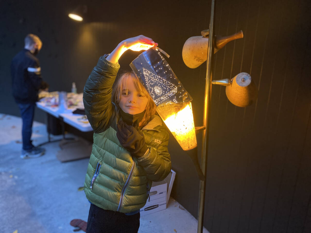 Photo courtesy of Port Angeles Fine Arts Center / Miles Fradkin holds up a lantern he made at one of last year’s youth workshops.