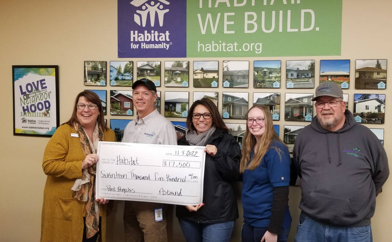 Photo courtesy of Astound Broadband Powered by Wave / From left, Colleen Robinson — CEO of Habitat for Humanity of Clallam County — accepts a $17,500 grant from Astound Broadband Powered by Wave staffers Jake Crabtree, Tracy Vann, Sierra Wilkens and Guy Eyraud.