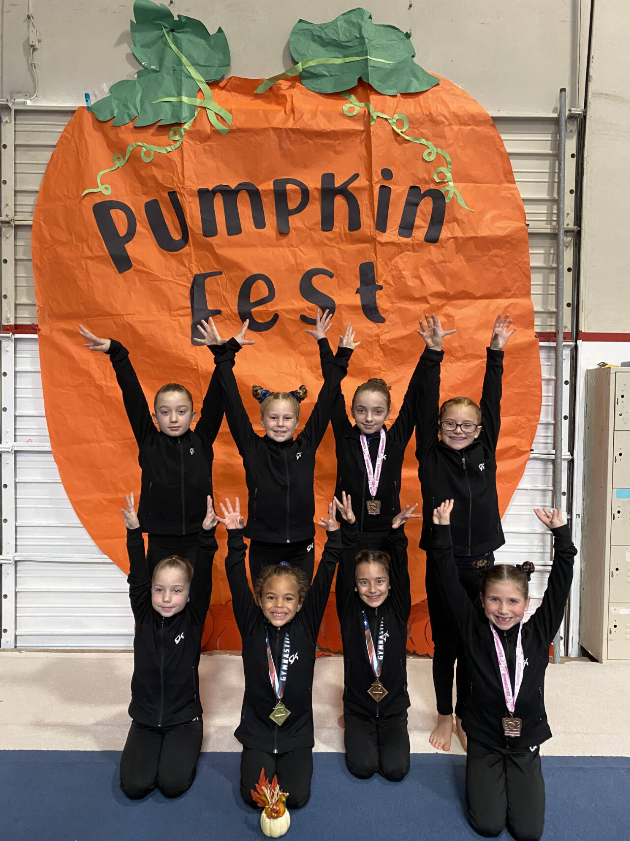 Submitted photo / Klahhane Gymnastics’ Bronze Team members include (back row, from left) Raeleigh Thomason, Morgan Smith, Lainey DePiro and Harper Waterkotte, with (front row, from left) McKinlee Thomason, CarlyMae Riggs, Paytynn Lindley of Sequim and Charlotte Nevil.