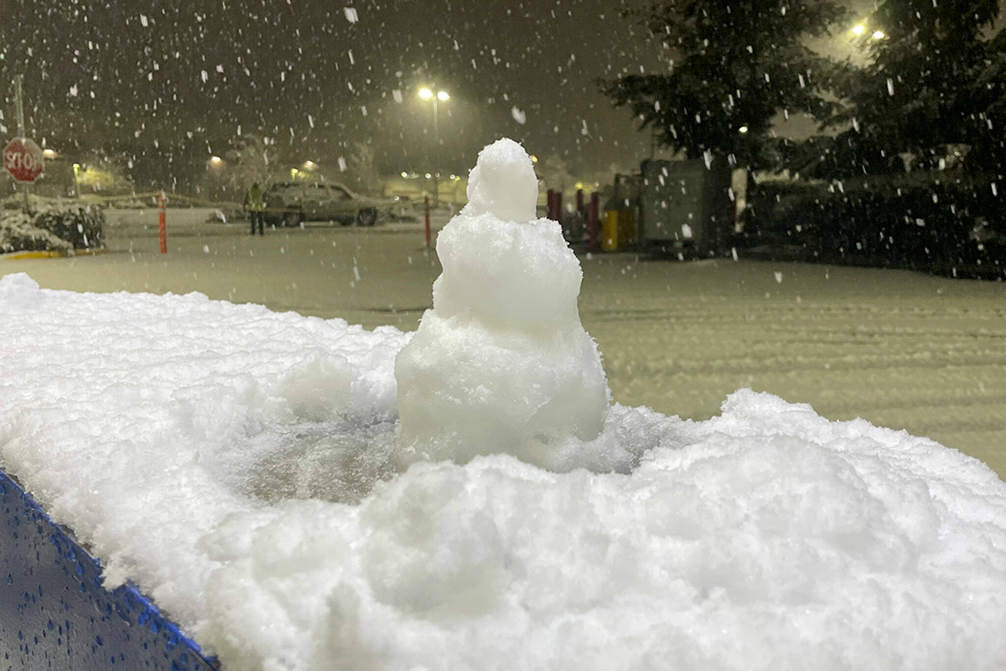 Sequim Gazette photo by Matthew Nash/ A mini-snowman greets the few drivers out at the Sequim Costco Fuel Station during the snowstorm on Nov. 7.