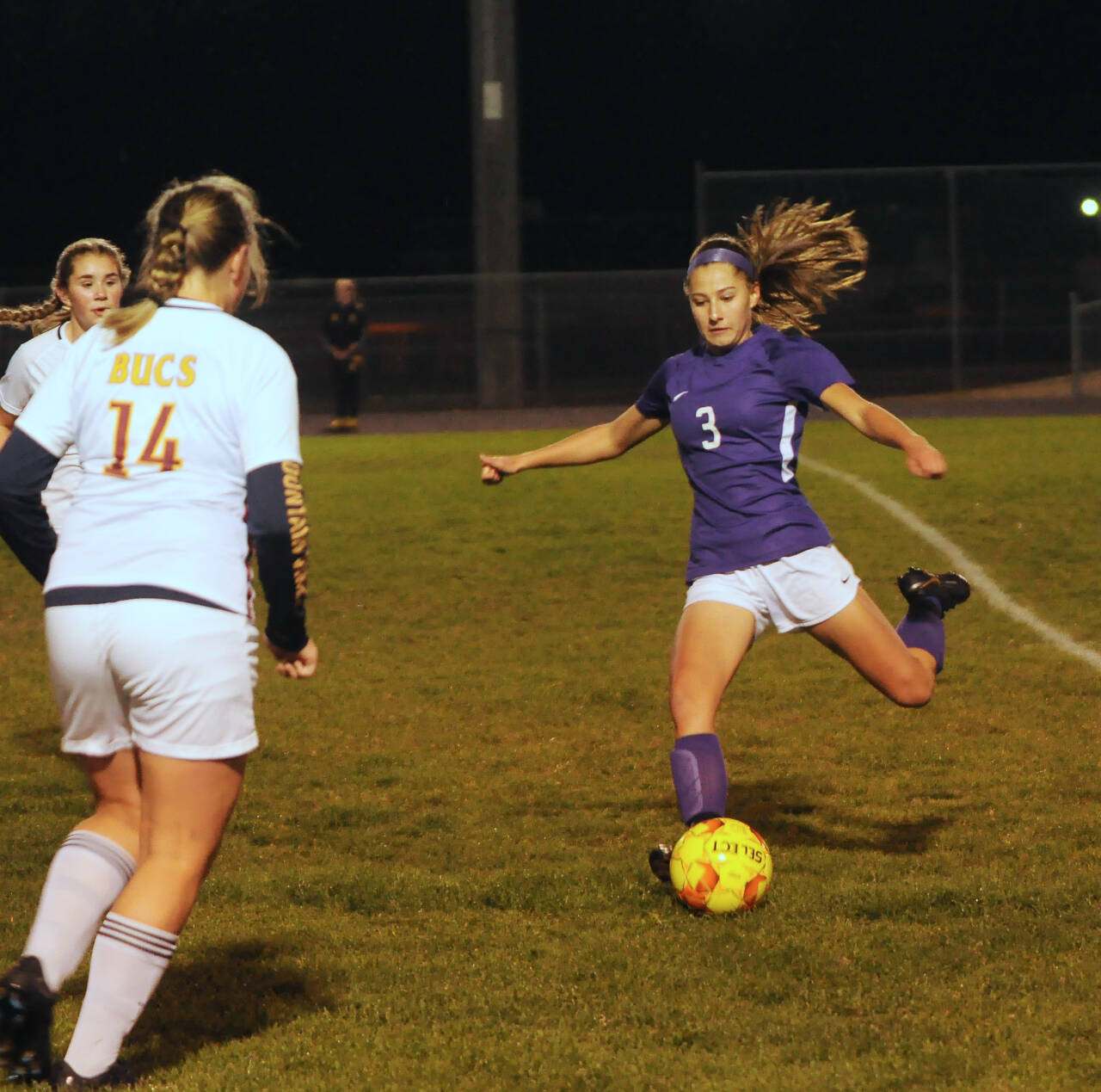 Sequim’s Taryn Johnson, right, looks for an open teammate as the Wolves take on Kingston at home on Oct. 27. Sequim won the Olympic league match-up, 4-0.