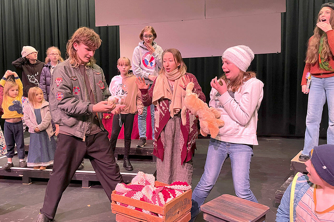 Sequim Gazette photo by Matthew Nash/ Ralph Herdman (Donovan Rynearson) pulls a leg off the prop baby Jesus in “The Best Christmas Pageant Ever” as director Grace “Mother” Bradley’s (Shannon Bertucci), his sister Imogene Herdman (Emerson Jacobs) and the pageant cast react.