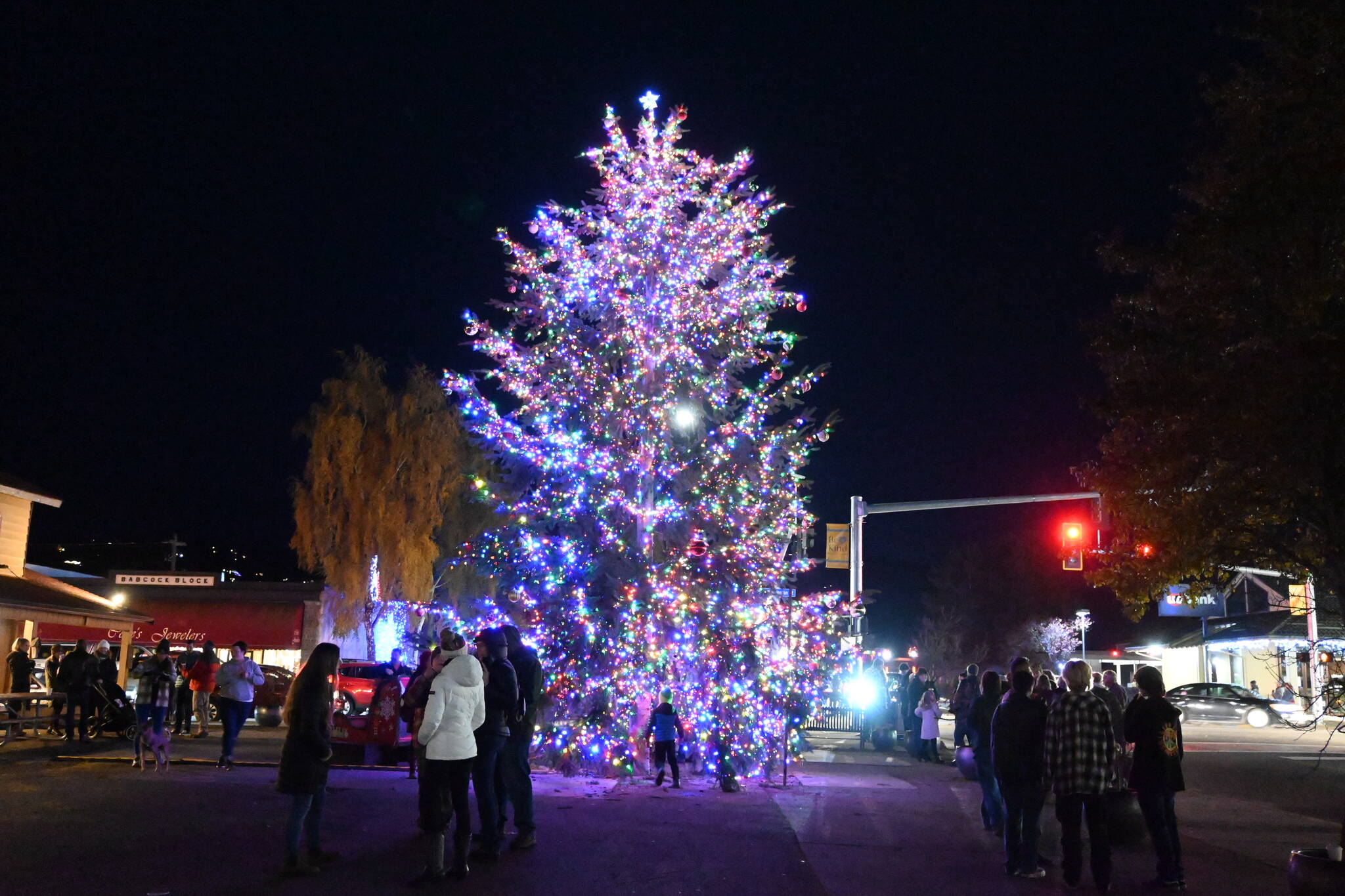 Sequim Gazette photo by Michael Dashiell / People flock to Sequim’s downtown Christmas Tree at a tree-lighting ceremony on Saturday, Nov. 26, at Centennial Place. The major sponsor for the tree lighting, organizers note, is Sound Community Bank, with in-kind sponsors including Accurate Angle Crane, The Home Depot and the City of Sequim.