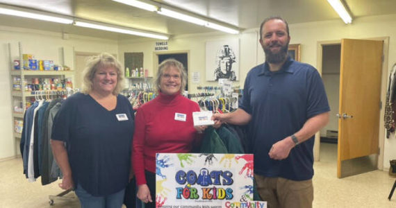 Submitted Photo
Coats For Kids organizers Karen Lewis and Heidi Albrecht present Levi Douglas, Clallam County Veterans Program Coordinator, with more than $1,200 worth of certificates for veterans at the Northwest Veterans Resource Center.