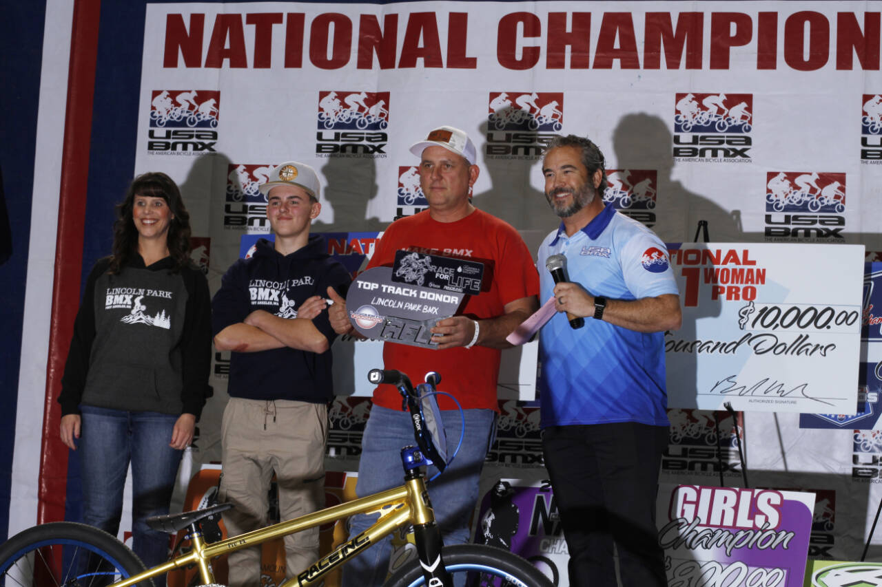 courtesy photo/USABMX 
From left, Lori Coleman, Cash Coleman, Lincoln Park BMX Track Operator Sean Coleman and USABMX Chief Strategy Officer John David celebrate Lincoln Park’s No. 2 finish among Race For Life fundraisers.