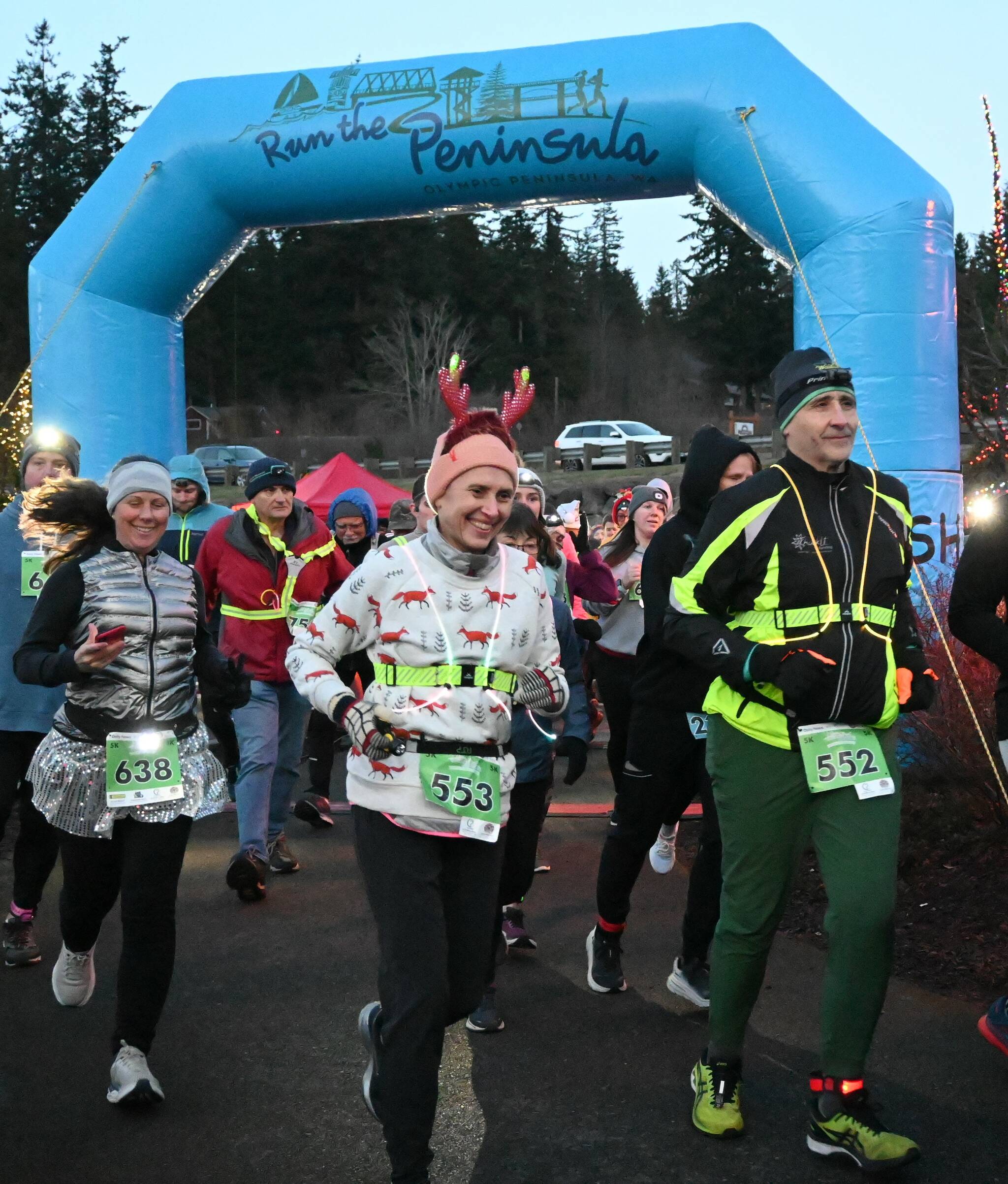 Sequim Gazette photo by Michael Dashiell / Runners and walkers cross the starting line at the 2022 Jamestown S’Klallam Tribe 5k/10k race on Dec. 3.