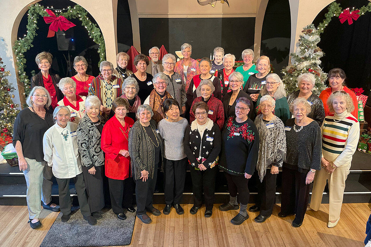 Sequim Gazette photo by Matthew Nash/ Volunteers with the Sequim Dungeness Hospital Guild gather for a photo during their Dec. 6 volunteer appreciation luncheon in Olympic Theatre Arts. It was their first event honoring volunteers since 2017.
