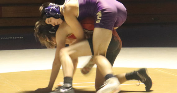 Photo by Roger Burwash / Sequim’s Cayden Beauregard, top, takes on a Kingston wrestler in the 113-pound weight class in the Wolves’ Dec. 14 home league meet.
