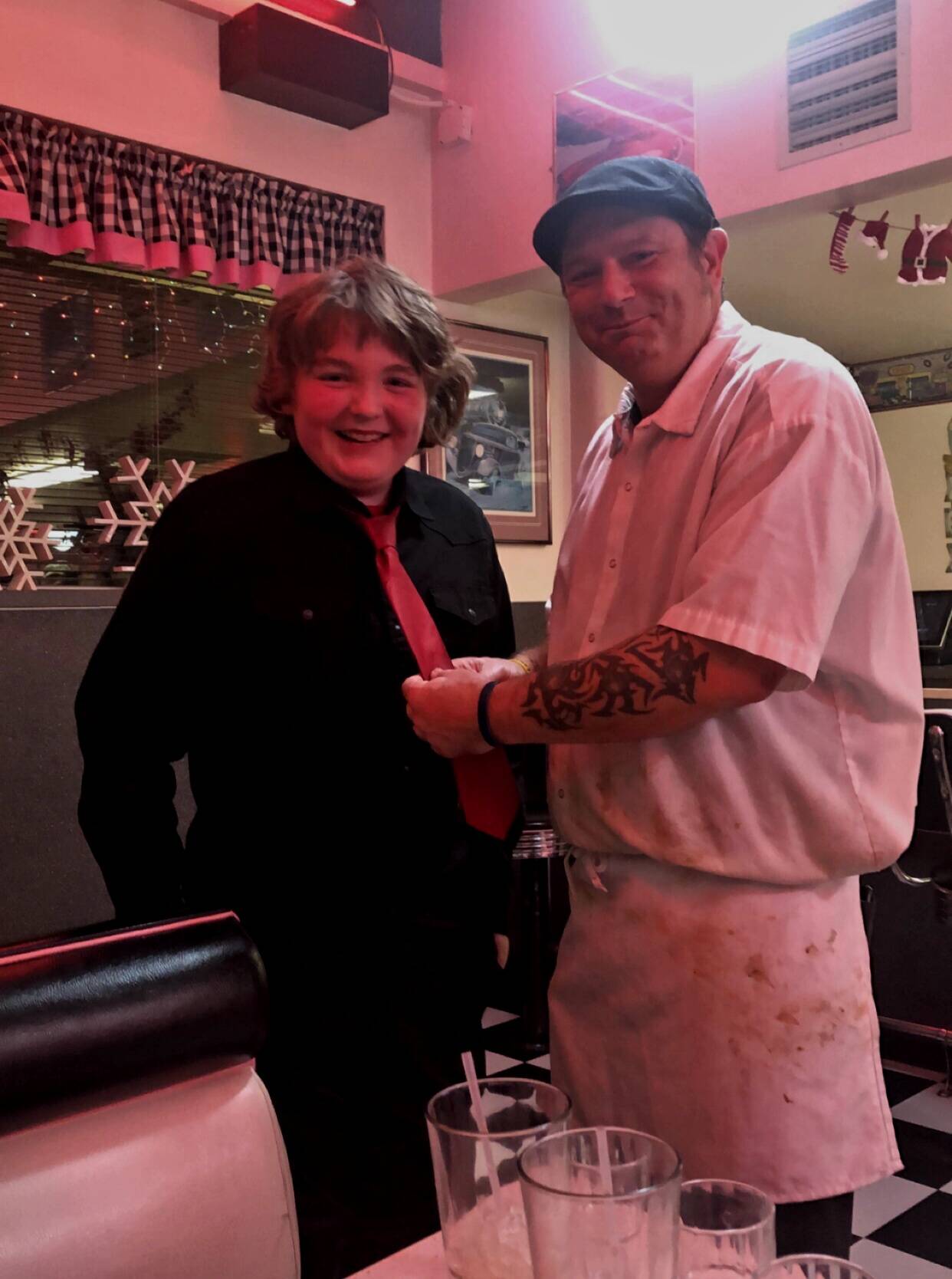 Submitted photo 
Above: Anthony Ingram stands with chef Joshua Hicks at Hi-Way 101 Diner in early December after Hicks helped him tie his tie before a band concert. His grandmother Joanne Tisch said she didn’t know how to tie a tie, and asked around the restaurant before Hicks volunteered.