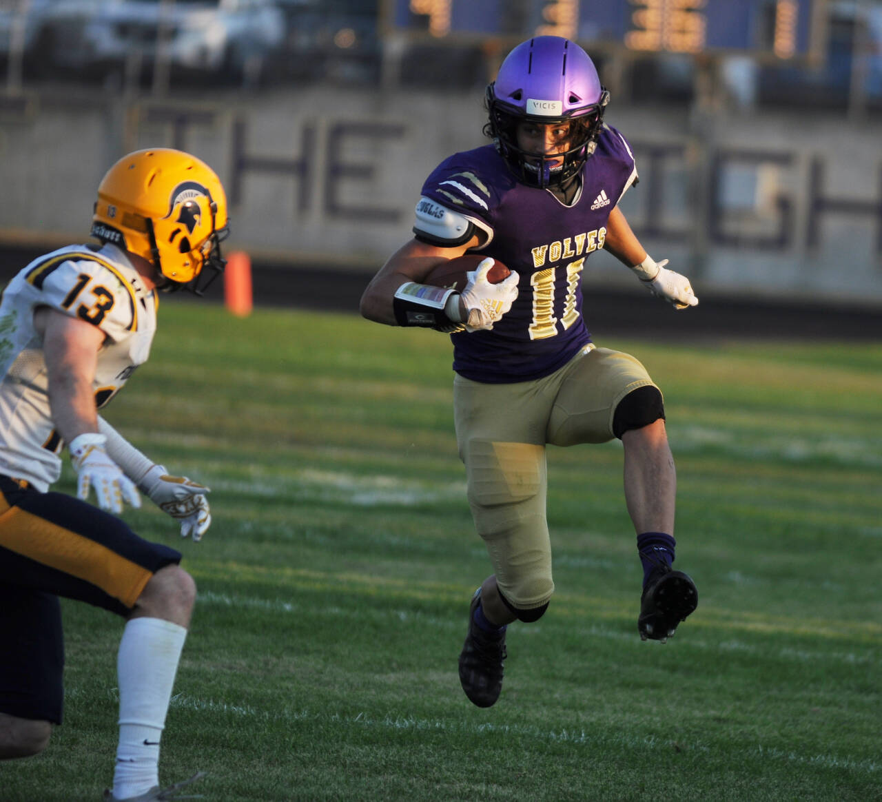 Sequim Gazette photo by Michael Dashiell / Sequim’s Aiden Gockerell looks to a tackle by Forks’ Ryan Rancourt in the first half of the Wolves’ season-opener at home on Sept. 2. Gockerell was named to the Peninsula Daily News All-Peninsula Football Team, along with teammates Ayden Holland and Jack Henninger.