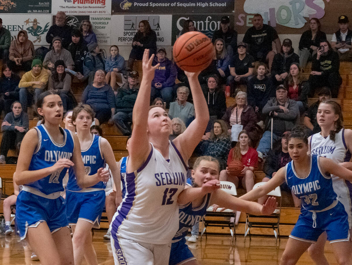 Sequim Gazette photo by Emily Matthiessen / Sequim’s Sammie Bacon grabs a pass in the post and looks to score in the Wolves’ 64-25 home win over Olympic on Jan. 5. Bacon had nine points and a team-high seven rebounds.